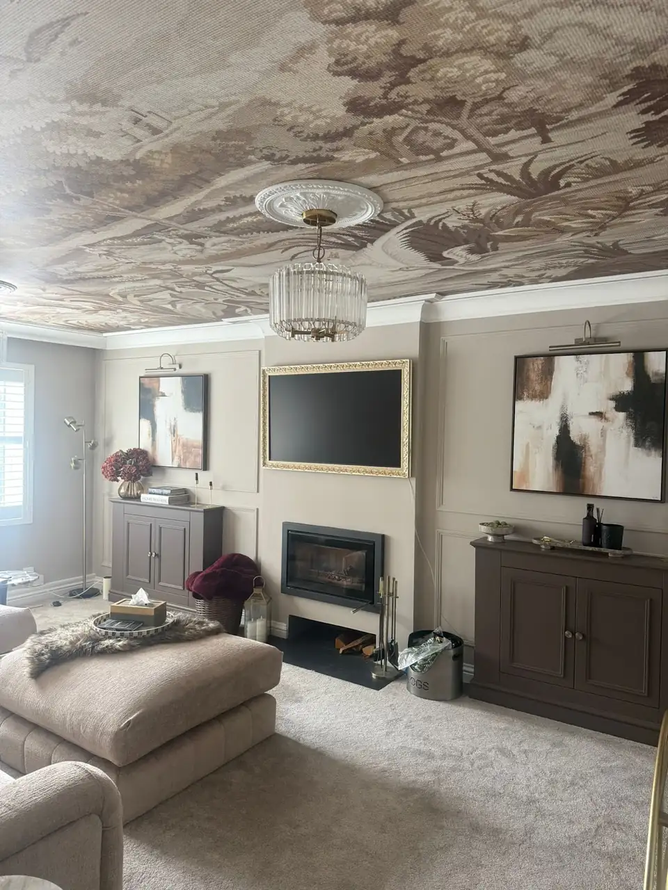 Living room with a woodland mural papered across the ceiling, decorated by JH Painting & Papering in Winchester